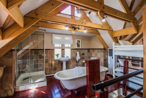 a bathroom with a tub and a sink at Craigivar Guesthouse in Pretoria