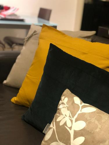 a group of pillows sitting on top of a bed at Lochiel Luxury Accommodation in Olinda