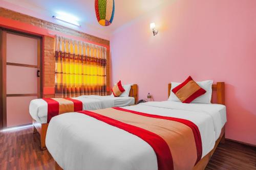 Ένα ή περισσότερα κρεβάτια σε δωμάτιο στο Hotel Everest Window View