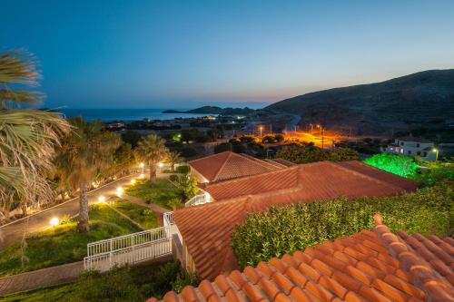 a view of a town at night at Iliovasilema in Platy