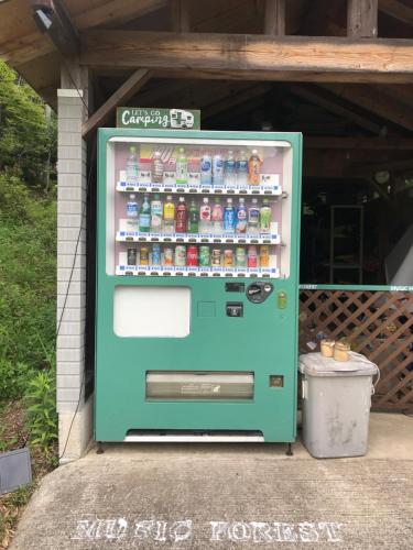 a vending machine filled with lots of soda bottles at 貸別荘MUSIC FOREST by MFR in Sasayama