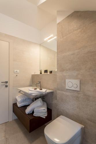 a bathroom with a sink and a toilet at Residence Stine in Split