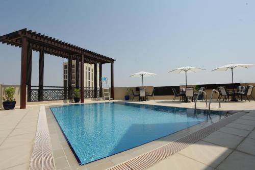 a swimming pool on the roof of a building at Marbella Holiday Homes in Dubai