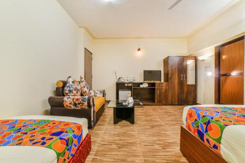 En eller flere senge i et værelse på FabHotel K7 Trends With Pool, Calangute Beach