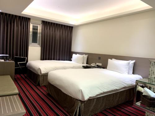Una cama o camas en una habitación de de rěve Express Hotel