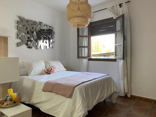 Ένα ή περισσότερα κρεβάτια σε δωμάτιο στο Apartamento con terraza en el Albaicin