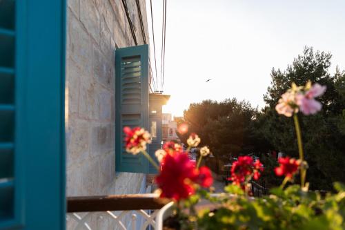 a window with flowers in front of a building at MYN in Rabat in Rabat