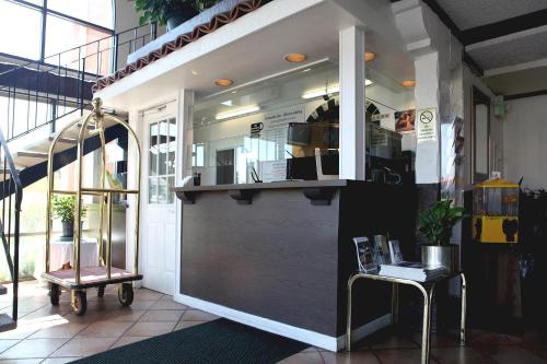 a kiosk in a building with a door and a table at Granada Inn in Santa Clara