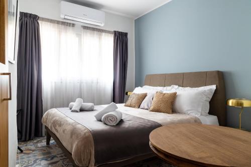 a bedroom with a bed with a table and a window at MYN in Rabat in Rabat