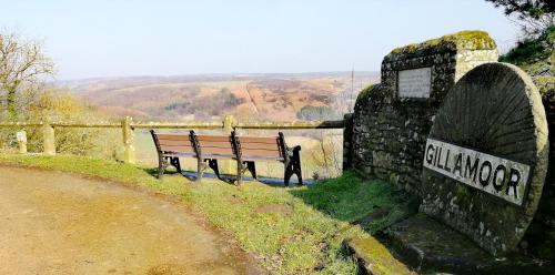 a bench sitting on the side of a road at The Royal Oak in Gillamoor