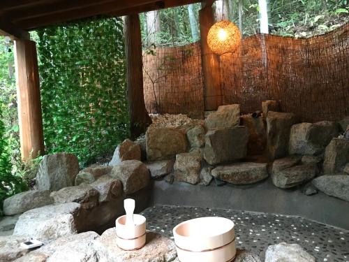 a room with rocks and bowls on a table at 貸別荘MUSIC FOREST by MFR in Sasayama