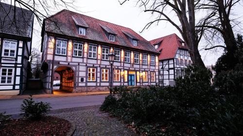 a large building with a lot of windows on a street at Hotel zur Fürstabtei in Herford