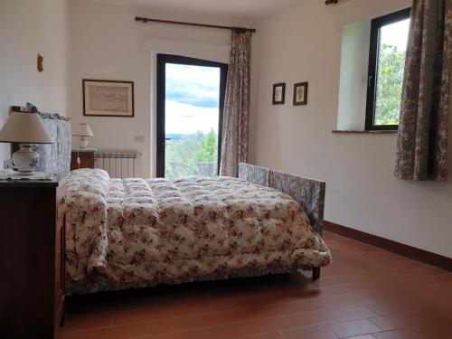 Una cama o camas en una habitación de Casa Lucia in Chianti
