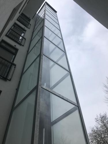 a tall glass building with the sky in the background at Apartmenthaus Hamburg Eppendorfer Weg in Hamburg