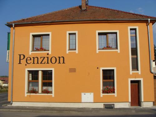 an orange building with the word pavilion on it at Penzion Vintrovna in Popůvky