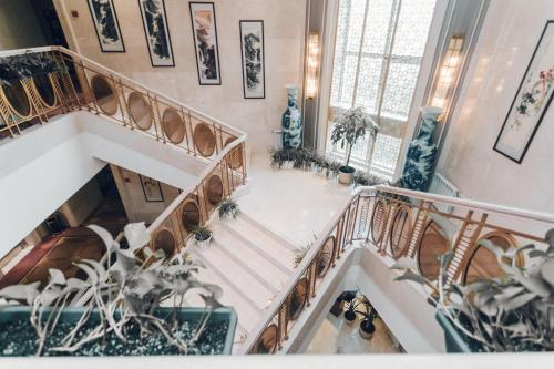 an overhead view of a staircase in a building at Soluxe Hotel Almaty in Almaty