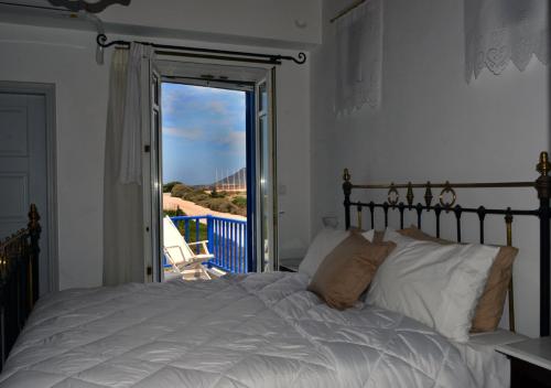 Katil atau katil-katil dalam bilik di Heliotropio Studios & Apartments
