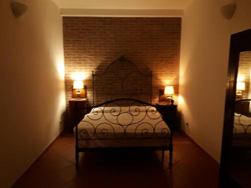Un pat sau paturi într-o cameră la Villa Biagi