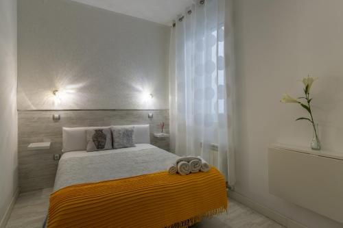 Letto o letti in una camera di Hostal Met Madrid