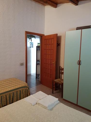 Ένα ή περισσότερα κρεβάτια σε δωμάτιο στο casa fronte mare puro relax