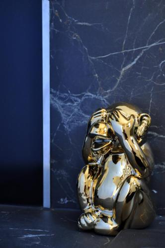 a gold and white object sitting on a table at Ibanova Appartements in Collioure