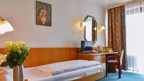 Cama o camas de una habitación en Hotel Mainbogen