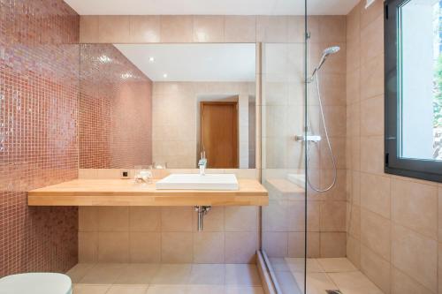 a bathroom with a sink and a shower at Boutique Villa Panorama in Tossa de Mar