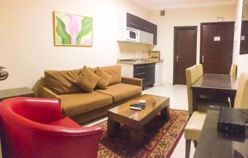 a living room with a couch and a table at Bella Rosa Hotel in Beirut