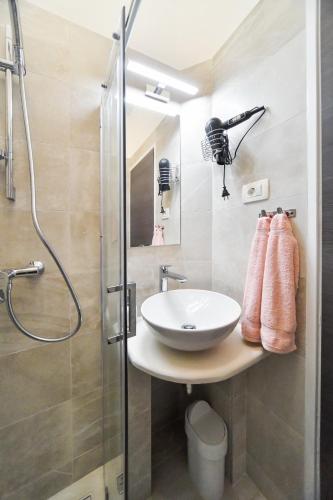 a bathroom with a sink and a shower at Rooms Nekic 1 in Zadar