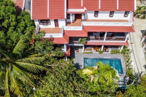an aerial view of a building with a swimming pool at An Bang Coco Villa in Hoi An