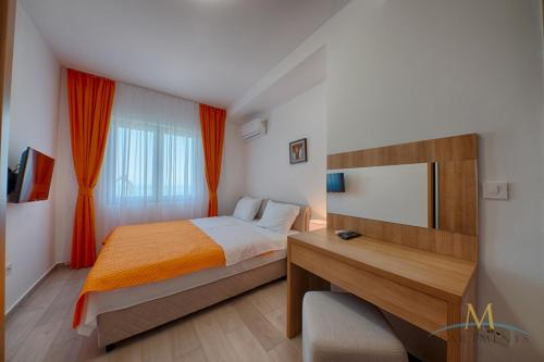 Postel nebo postele na pokoji v ubytování M Apartments