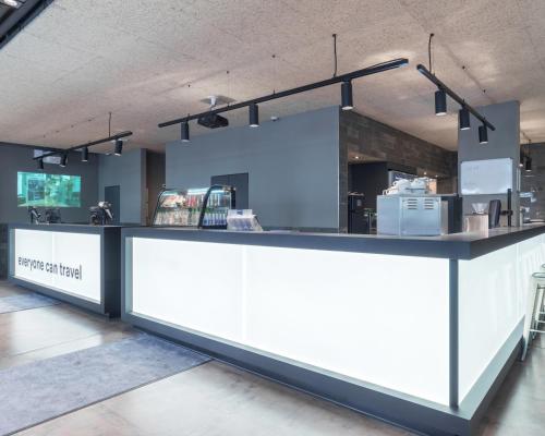 a counter in a room with a counter top at a&o Köln Neumarkt in Cologne