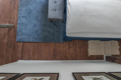 a bedroom with a bed with two pictures on the floor at meinsachsenwald forsthaus friedrichsruh in Aumühle