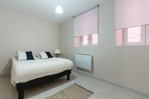 Giường trong phòng chung tại Appartement Marie