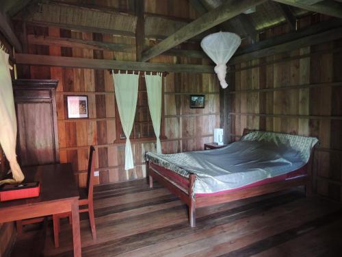 Postel nebo postele na pokoji v ubytování Arun Mekong Guesthouse
