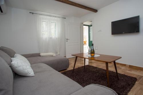a living room with a couch and a table at Spartion Marine in Split