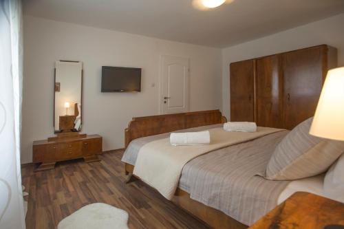 a hotel room with two beds and a mirror at Spartion Marine in Split
