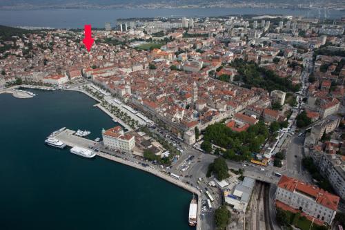 arial view of a city with a red arrow at Spartion Marine in Split