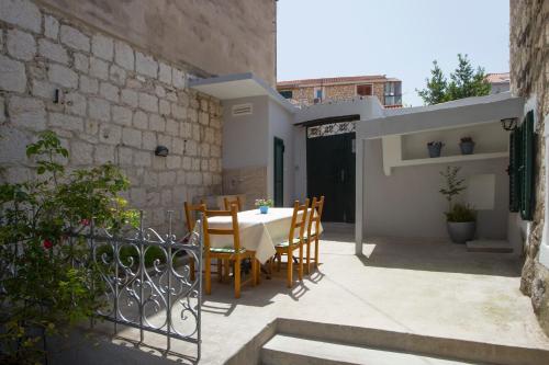 a patio with a table and chairs on a building at Spartion Marine in Split