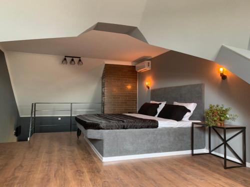 a bedroom with a large bed in a room at Beregynya in Yuzhnoukrainsk 