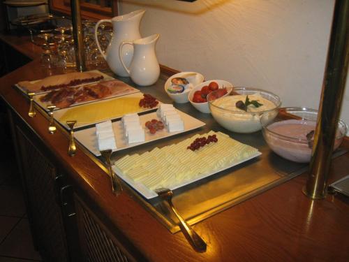 a counter with some food on a table at Wegeners Landhaus UG in Uelzen