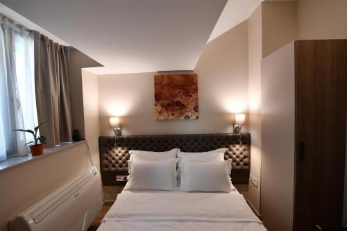 Ein Bett oder Betten in einem Zimmer der Unterkunft Apartments Srbija