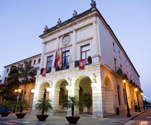 a building with two flags on the side of it at Los Palomitos, Casco Histórico VT-47255-V in Gandía