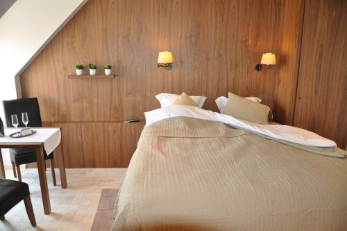 Een bed of bedden in een kamer bij B&B Cottage Santfort