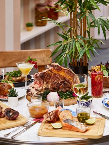 a table with a turkey and other food and drinks at Mama Shelter Toulouse in Toulouse