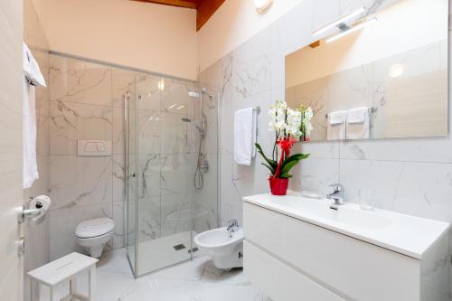 a bathroom with a sink toilet and a shower at Residenza San Rocco in Arco