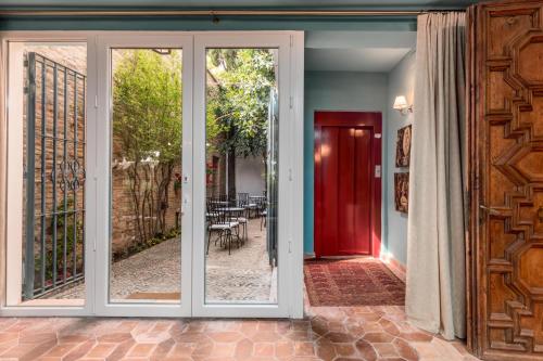 a sliding glass door with a view of a patio at Alquería Calatrava B&B in Burriana