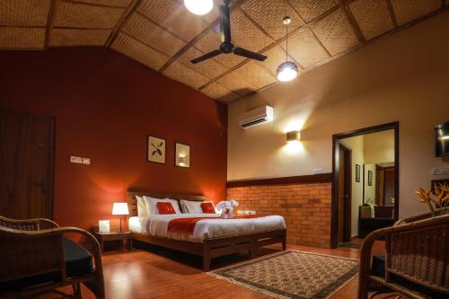 Postel nebo postele na pokoji v ubytování The Estate Resort , Mangalore