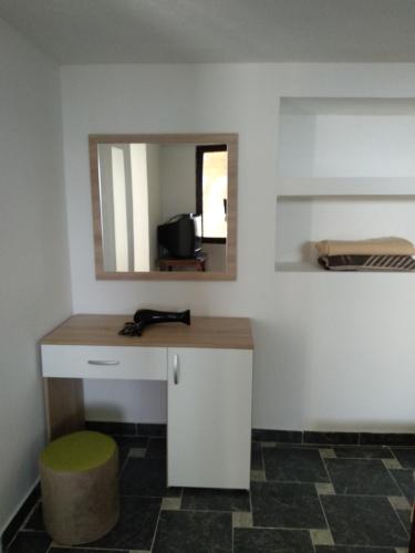 a room with a desk with a mirror and a stool at Villa Two Brothers in Ohrid