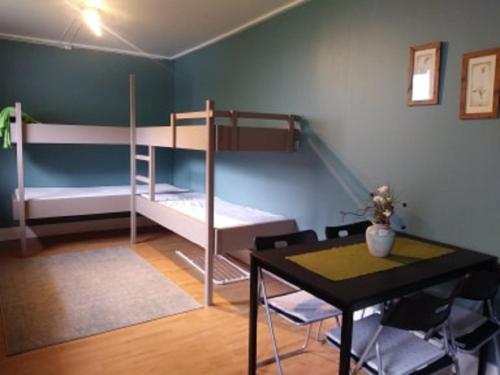 a room with two bunk beds and a table at Songesand Camp in Songesand